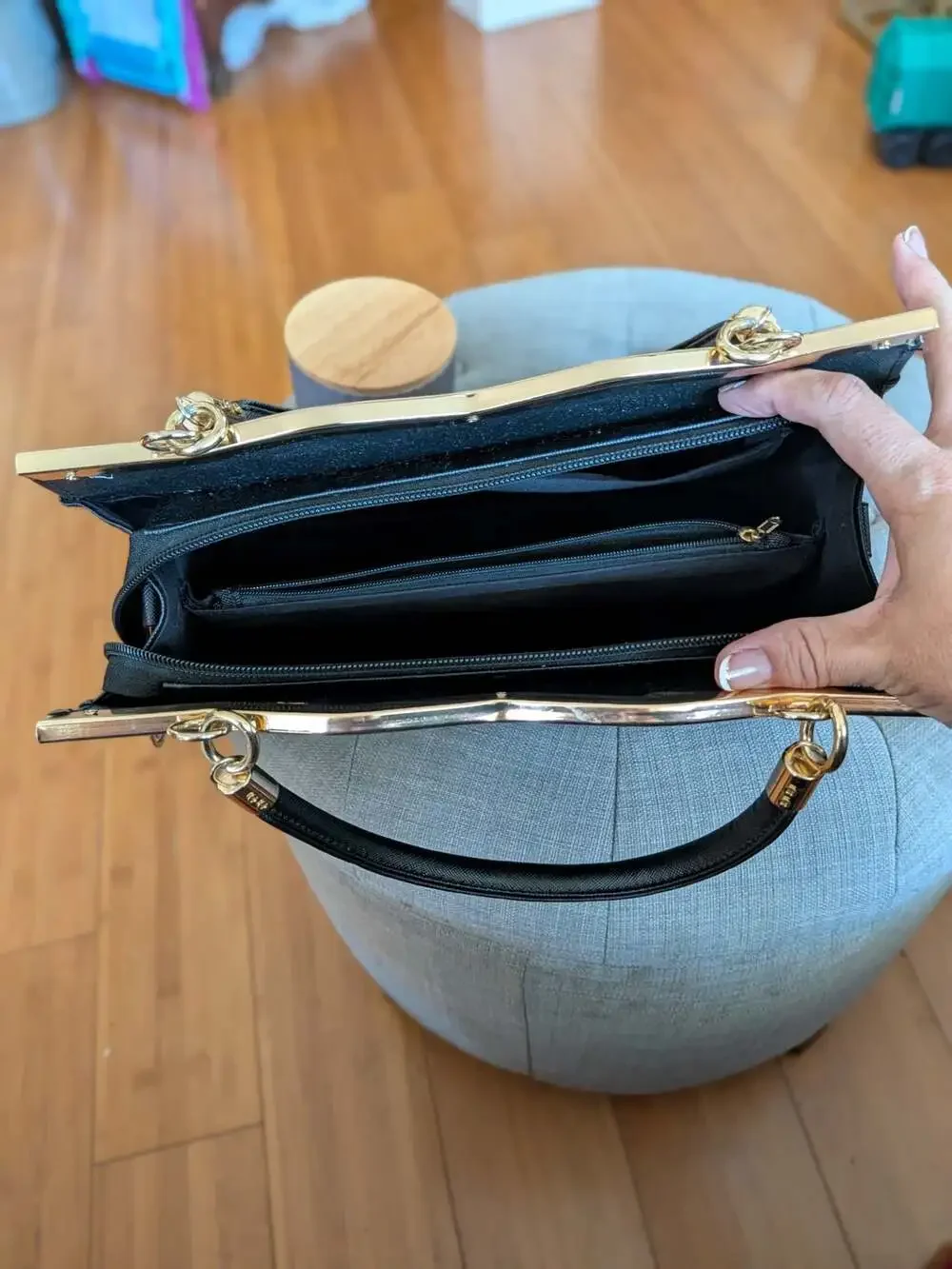 Black Saffiano Leather Handbag Satchel with Gold Bow Accent and Metal Trim